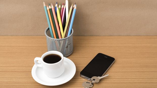 coffee,phone,key and pencil on wood table background