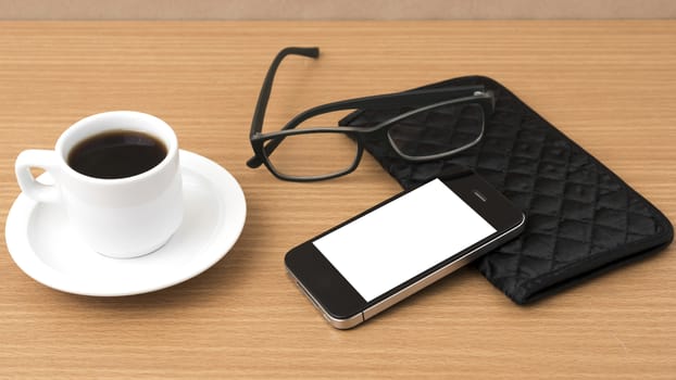 coffee,phone,eyeglasses and wallet on wood table background
