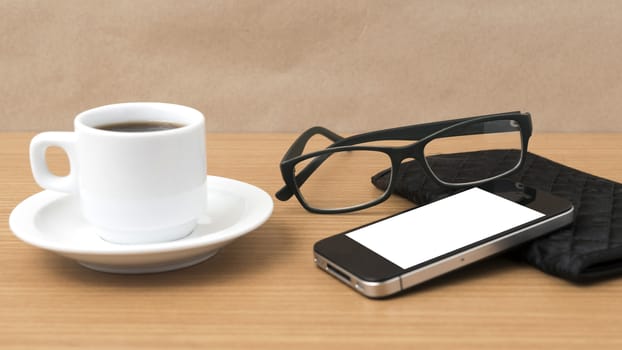 coffee,phone,eyeglasses and wallet on wood table background
