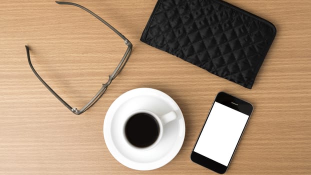 coffee,phone,eyeglasses and wallet on wood table background