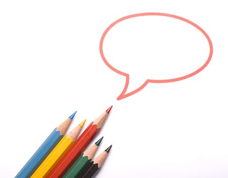 Top view of five colored pencils with the red one having a speech bubble above him. Metaphor for leadership