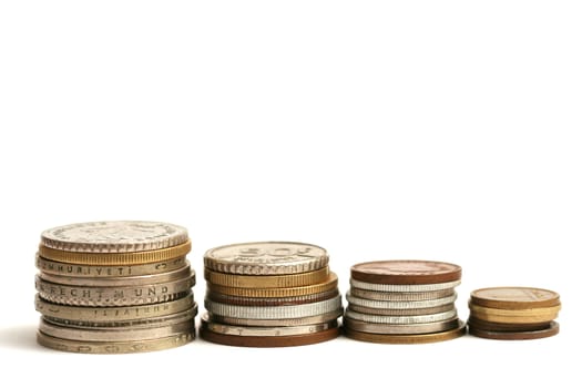 Old European coins of different currency on white background