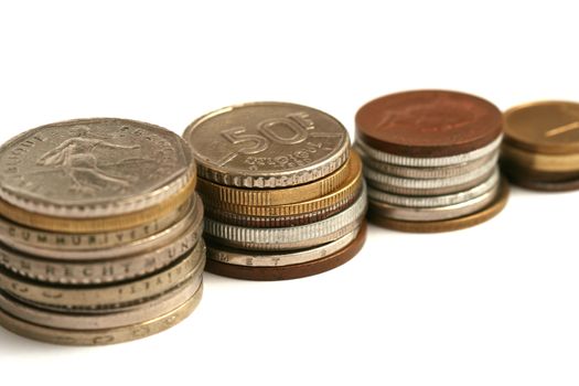 Old European coins of different currency on white background