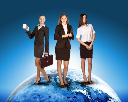 Business ladies on earth on abstract blue background