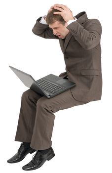 Confused businessman working on laptop isolated on white background