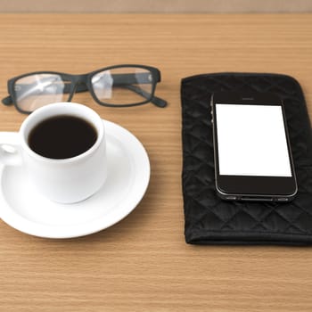 coffee,phone,eyeglasses and wallet on wood table background