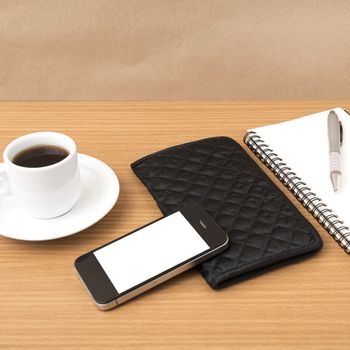 coffee,phone,notepad and wallet on wood table background