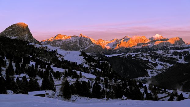 last sunny lights of the day in a romantic sunset over the mountains of Alta Badia, Trentino-Alto Adige - Italy