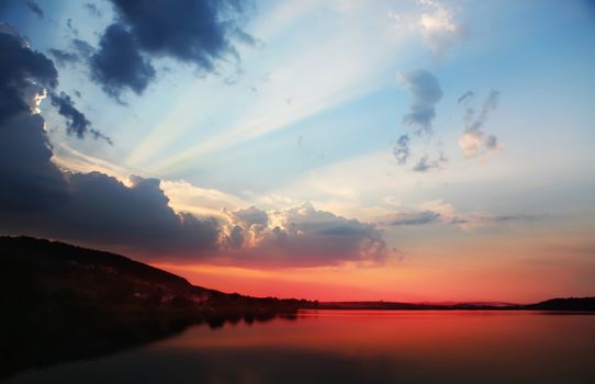 Sunset with clouds, light rays and other atmospheric effect