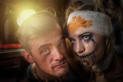Horrible girl with her boyfriend, zombie halloween theme