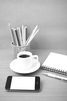 coffe,phone,notepad and color pencil on wood table background black  and white color