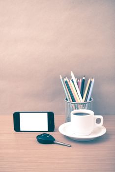 coffee,phone,car key and heart on wood table background vintage style