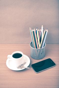 coffee,phone,key and pencil on wood table background vintage style