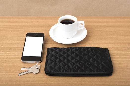 coffee phone key and wallet on wood table background