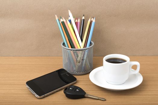 coffee,phone,car key and heart on wood table background