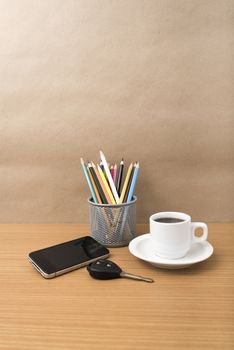 coffee,phone,car key and heart on wood table background