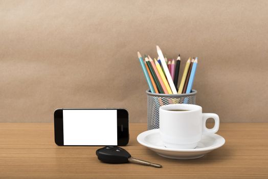 coffee,phone,car key and heart on wood table background