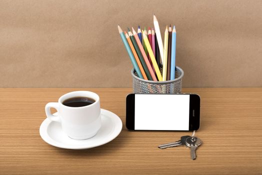 coffee,phone,key and pencil on wood table background