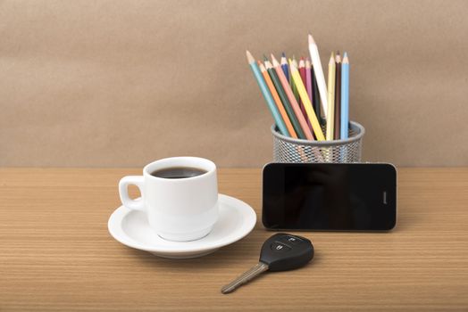 coffee,phone,car key and heart on wood table background