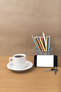 coffee,phone,key and pencil on wood table background