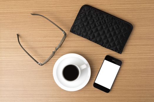 coffee,phone,eyeglasses and wallet on wood table background