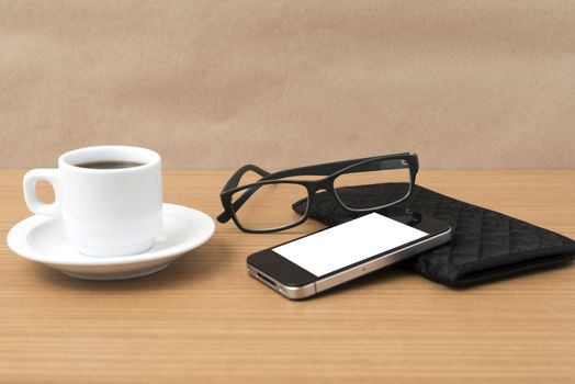 coffee,phone,eyeglasses and wallet on wood table background