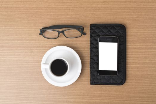 coffee,phone,eyeglasses and wallet on wood table background