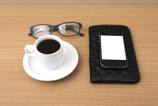coffee,phone,eyeglasses and wallet on wood table background