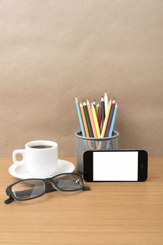 coffee,phone,eyeglasses and pencil on wood table background