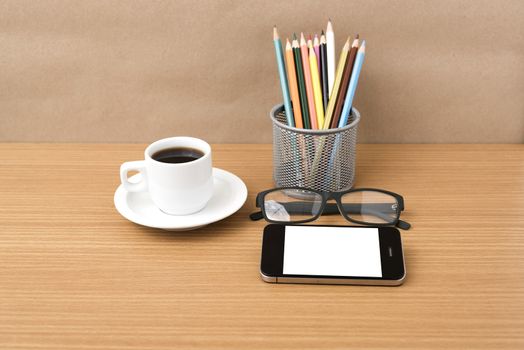 coffee,phone,eyeglasses and pencil on wood table background