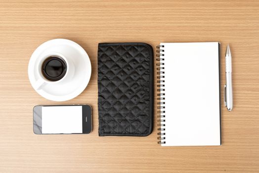 coffee,phone,notepad and wallet on wood table background