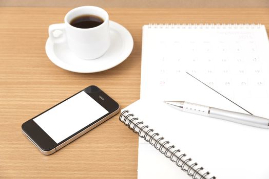 coffee,phone,notepad and calendar on wood table background