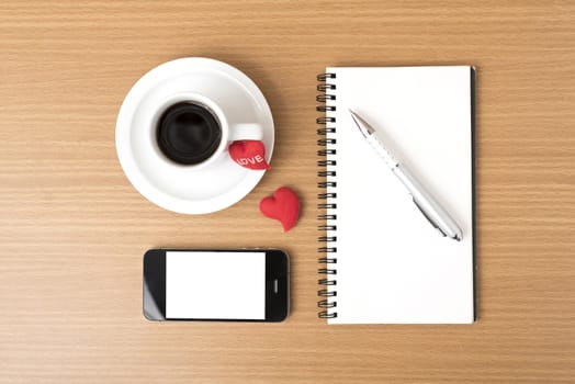 coffee,phone,notepad and heart on wood table background