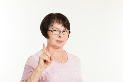 the beautiful mature woman with a severe look wearing spectacles