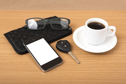 coffee,phone,car key,eyeglasses and wallet on wood table background