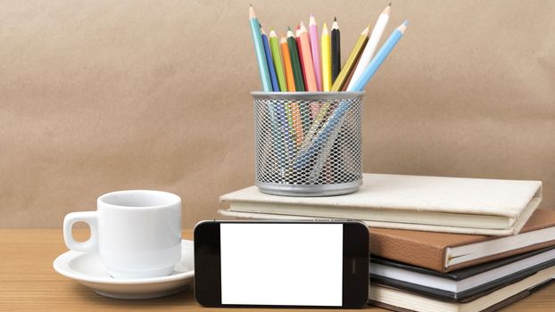 coffee,phone,stack of book and color pencil on wood table background