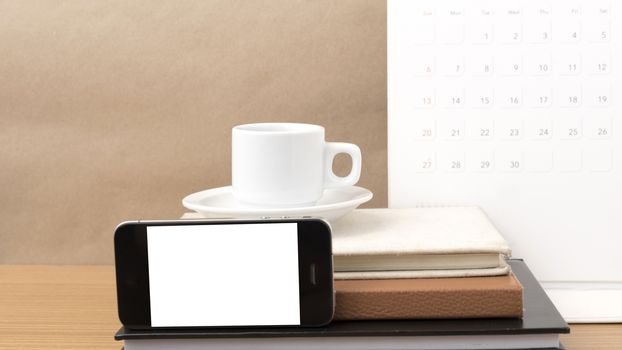 coffee,phone,stack of book and calendar on wood table background