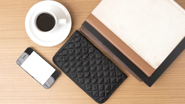 coffee,phone,stack of book and wallet on wood table background