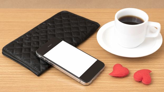 coffee,phone,wallet and heart on wood table background