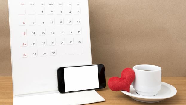 coffee,phone,calendar and heart on wood table background