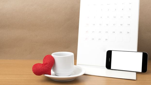 coffee,phone,calendar and heart on wood table background