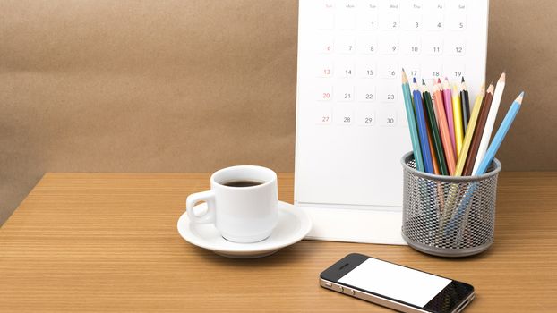 coffee,phone,calendar and color pencil on wood table background