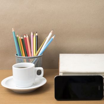 coffee,phone,stack of book and color pencil on wood table background