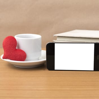 coffee,phone,stack of book and heart on wood table background