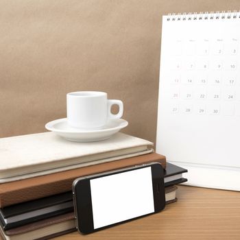 coffee,phone,stack of book and calendar on wood table background