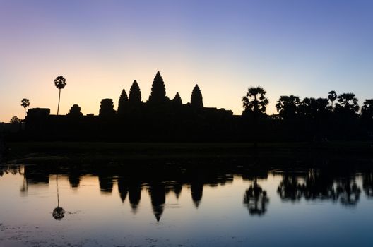 Silhouette of Angkor Wat temple at twilight in  Siem Reap, Cambodia