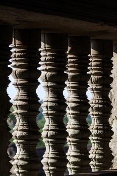 Detail of the turned stone bars of a window at the Angkor Wat in Siem Reap, Cambodia. Selective Focus.