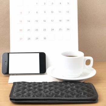 coffee,phone,wallet and canlendar on wood table background