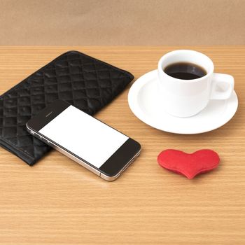 coffee,phone,wallet and heart on wood table background