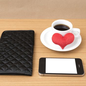 coffee,phone,wallet and heart on wood table background